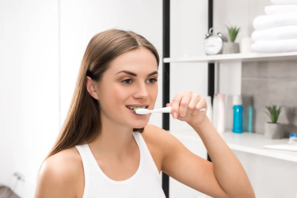 Women using whitening toothpaste